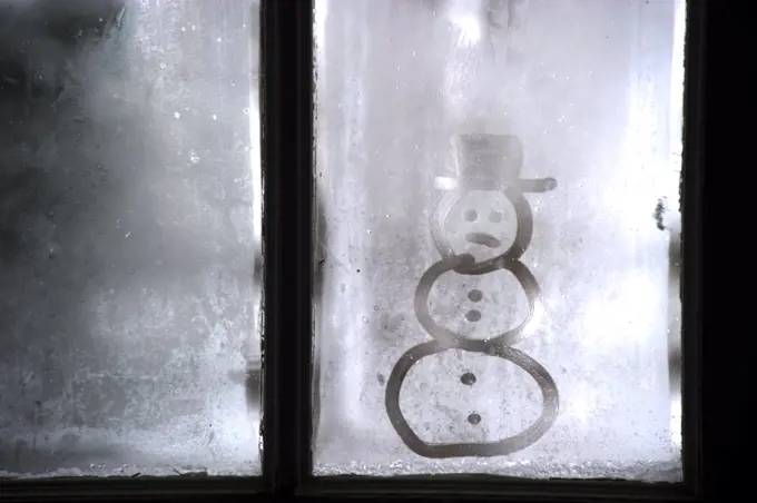 Snowman image on frosty window. (Photo by: Edwin Remsburg/VW Pics)