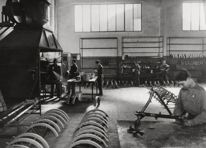 Spanish industry (1958). Paint booth in a factory of components for motorcycles. Barcelona, Catalonia, Spain. 