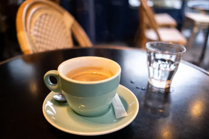 A cup of coffee at a cafe. Illustration of tourism and daily life in Greater Paris. France.