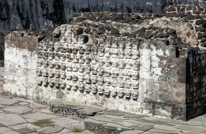 Wall of stone skulls called Tzompantli, archaeological site and museum of Templo Mayor, Mexico City, Mexico.