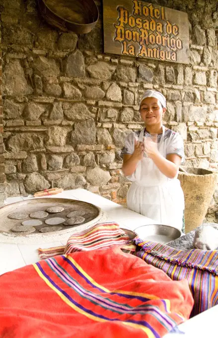 Woman Making Bread Tortillas In Antigua, Guatemala