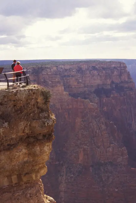 Arizona, Grand Canyon. Couple Standing By Railing At Scenic Overlook