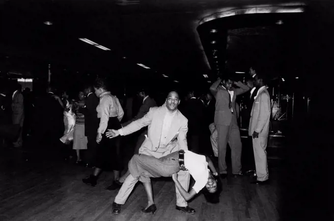 Two African-American people dancing rock 'n roll in a nightclub. New York, April 1959