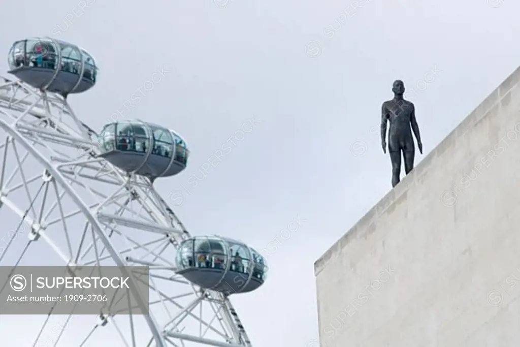 London Eye and Anthony Gorrmley Sculpture Figure on Queen Elizabeth Hall South Bank Event Horizon Exhibition London England UK United Kingdom GB Great Britain British Isles Europe EU This image replaces ACXJEM