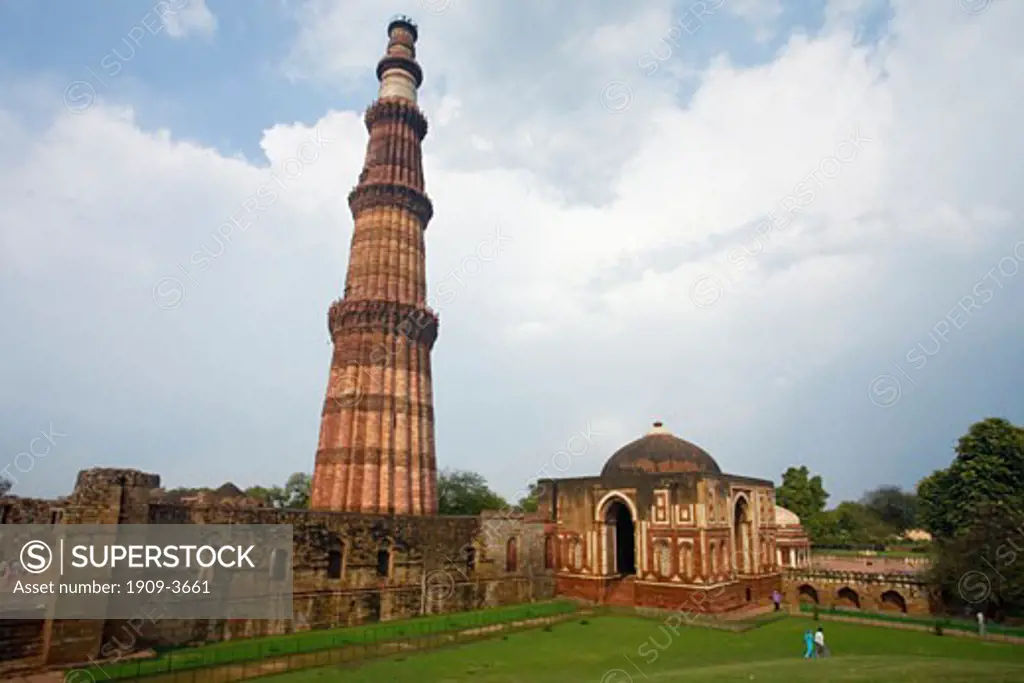 Qutub Qutb Minar Tower in Delhi is the tallest brick minaret in the world at 72 meters high built in 12th - 13th century with courtyard and carved stone pillars taken from Hindu Temple India Asia