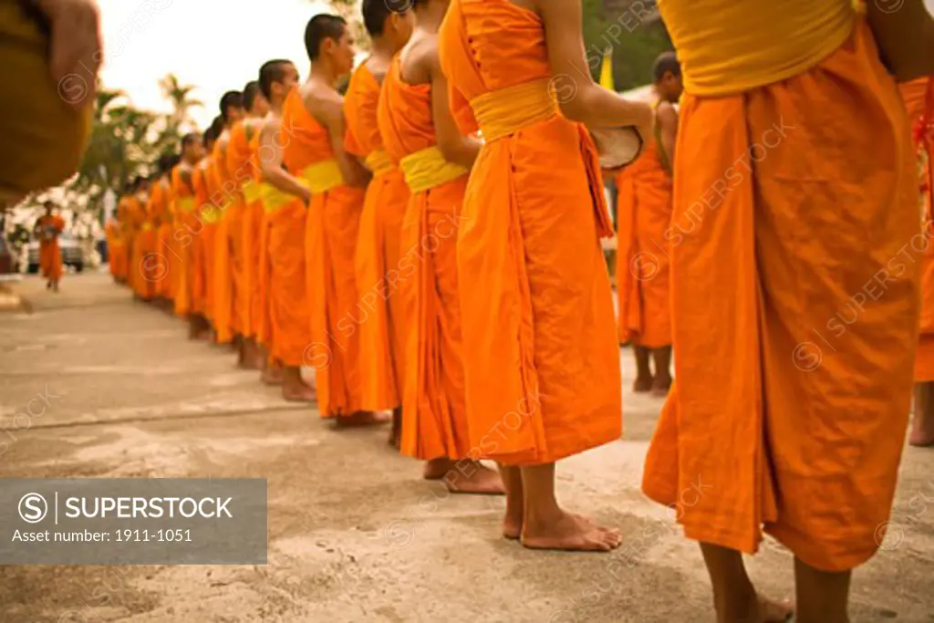 Buddhist Monks collecting food and special Sonkran Blessing  Wat Srisoda  Buddist Temple and Monastery  Chiang Mai  Thailand  SE Asia