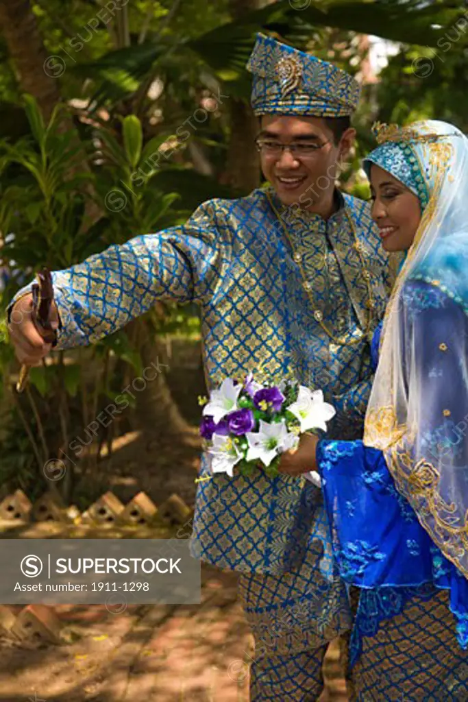 young couple in wedding clothes  Malacca  Historic Melaka   Malaysia Peninsula  Malaysia  SE Asia