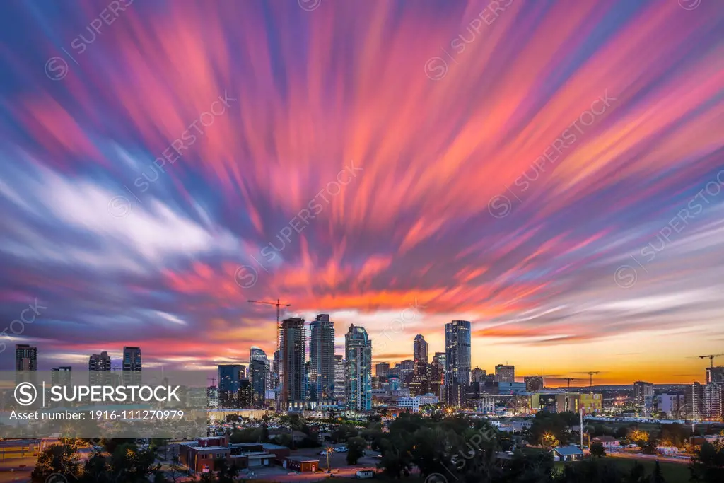 A cloud streak” photo made using the same techniques as in stacking star trails only its the clouds trailing, or streaking. I shot this Canada Day, July 1, 2015 from Scotsman Hill overlooking Calgary, awaiting the fireworks. This is a stack of 110 frames, merged with Advanced Stacker Actions using the Ultrastreaks action. Despite the blending, the ~ 8s gap between exposures still led to gaps in the streaks - you’d have to shoot at 1s intervals to eliminate them. To smooth out the gaps I added a