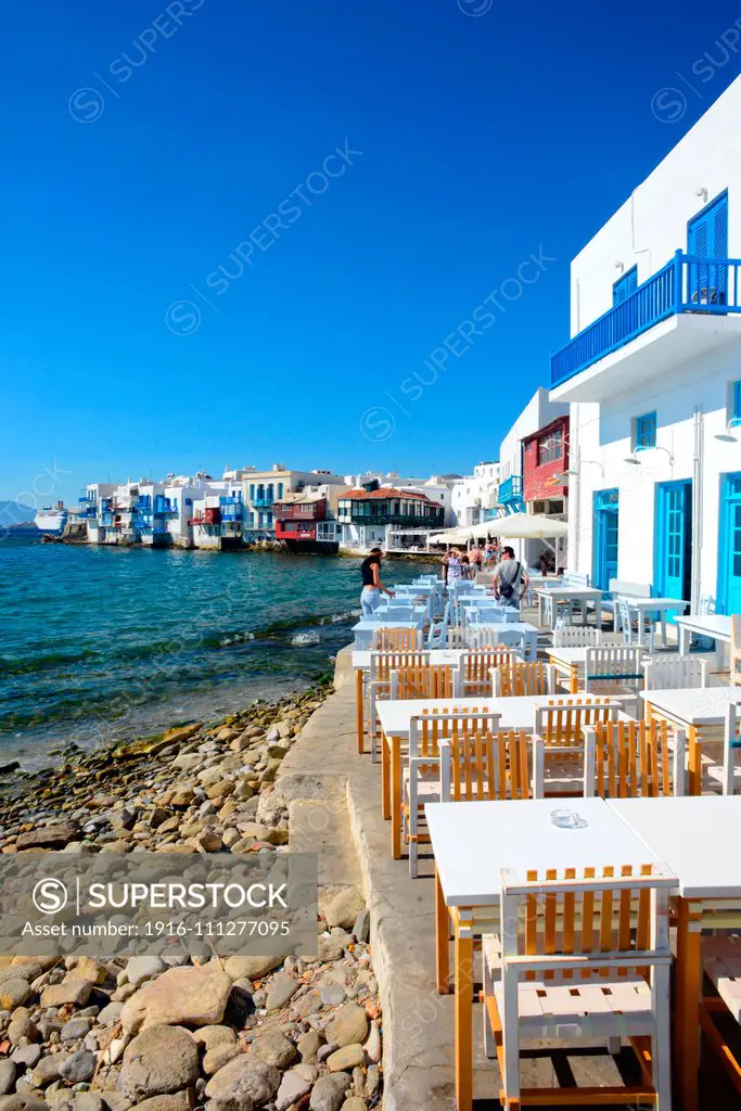 Cafe terrace with Little Venice in view, Mykonos, Greece