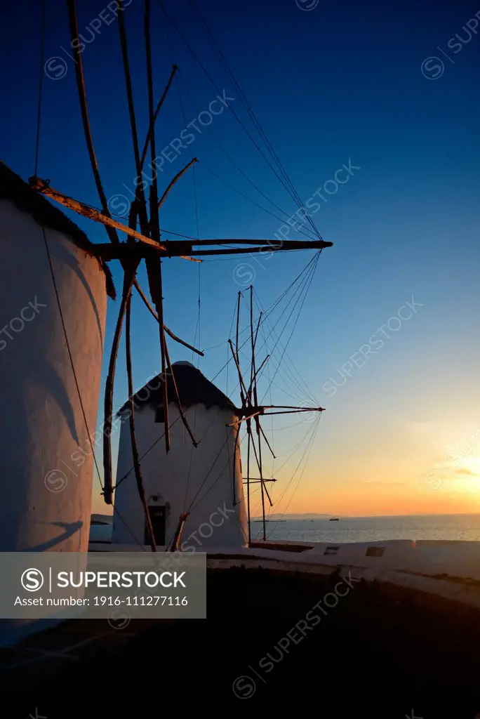 Traditional windmills (Kato Milli) at sunset in Mykonos town, Greece