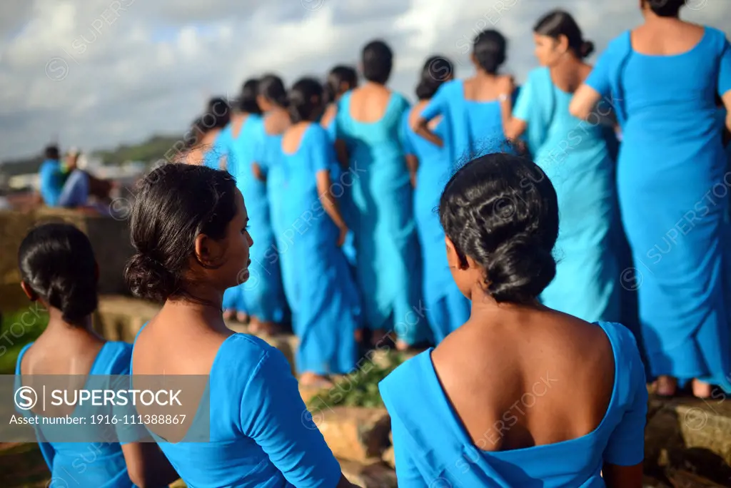 Numerous group of college students dressed in blue visit UNESCO World Heritage, Galle Fort, during Binara Full Moon Poya Day.