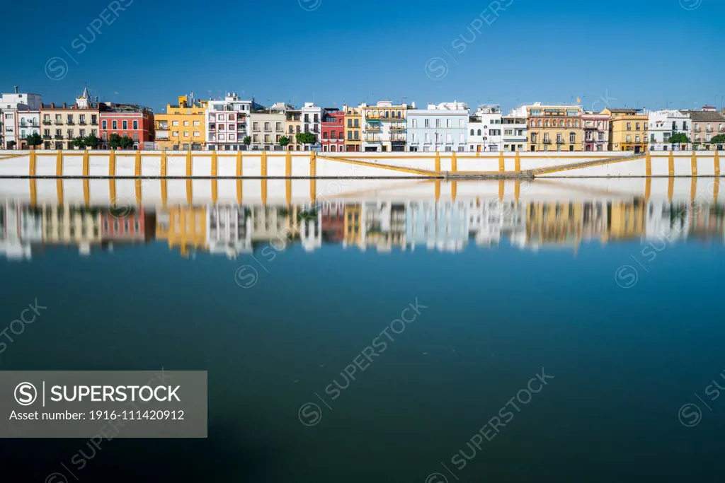 Betis street reflected on the Guadalquivir river, Seville, Spain