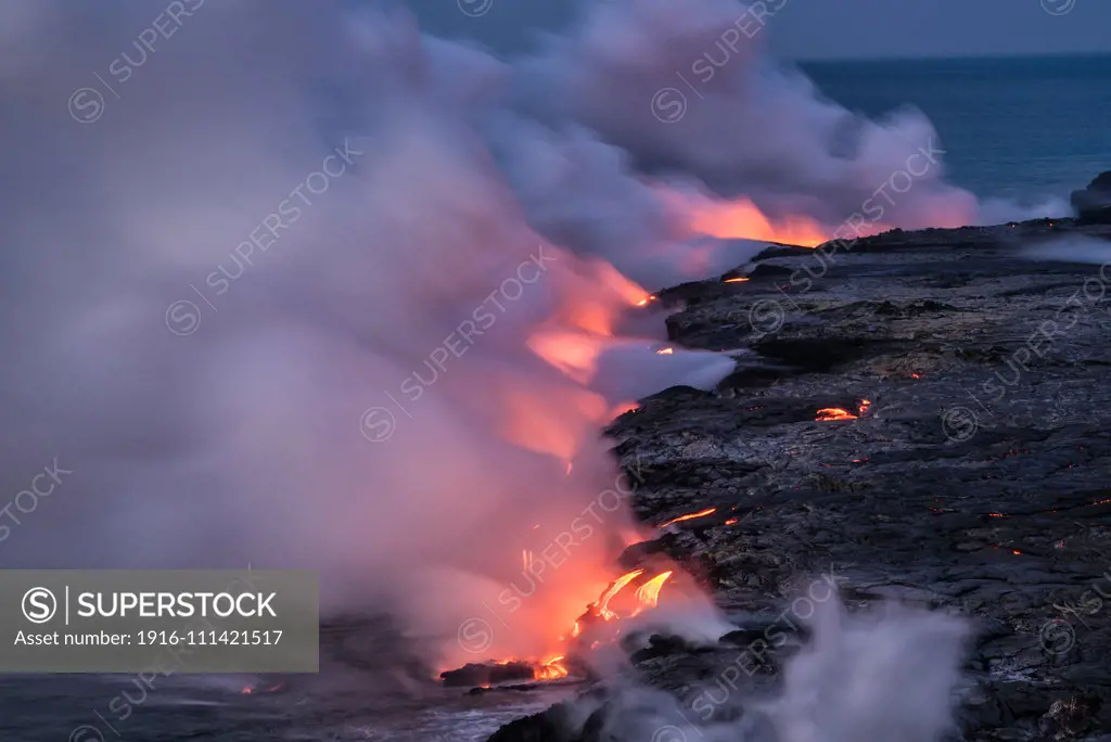 Lava from Pu'u O'o eruption entering the ocean; Hawaii Volcanoes National Park, Island of Hawaii.