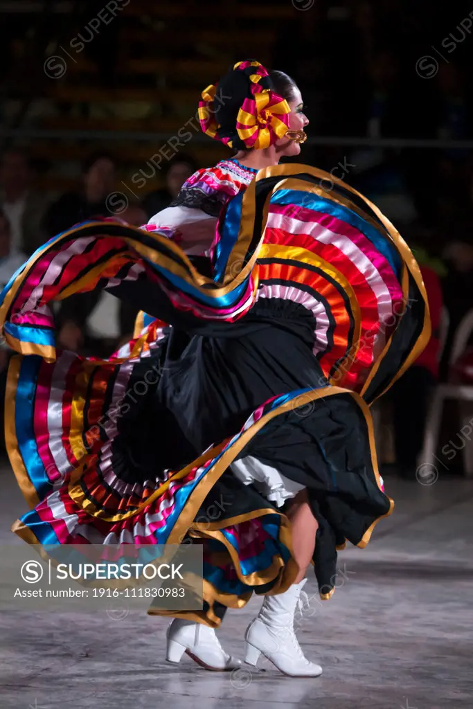 Woman dancing Son de la Negra. Mexican folk dance. International festival of folk dances El Buen Pastor School, municipality of Los Olivos, department of Lima, Colombia.