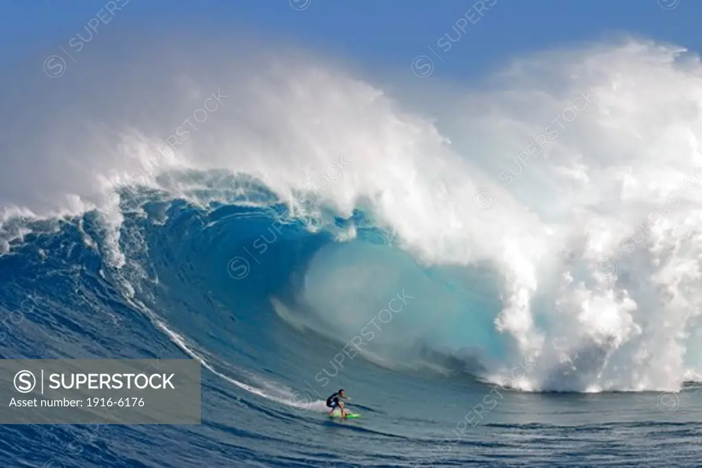 USA, Hawaii, Maui, Peahi, tow-in surfer drops to curl of Hawaii's big surf