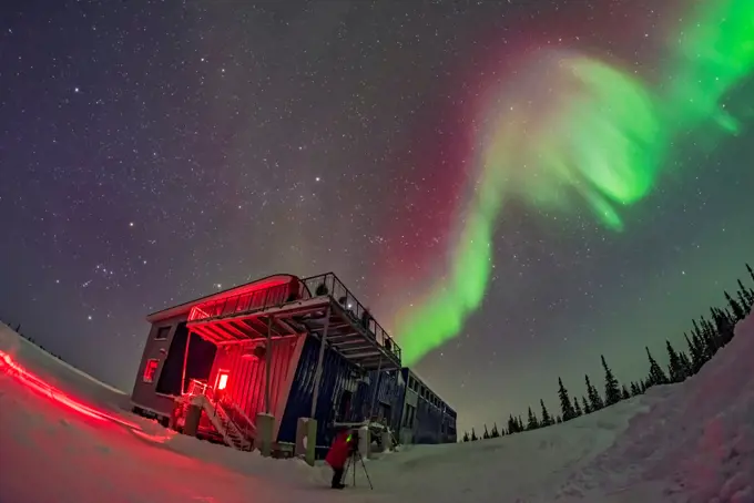 Orion and the winter sky, at left, and a swirl of colourful aurora over the Churchill Northern Studies Centre, in a display on February 11, 2018. People from the first Learning Vacations group of the season are shooting the Lights. This is a single image with the 12mm Rokinon full-frame fish-eye lens and Nikon D750.