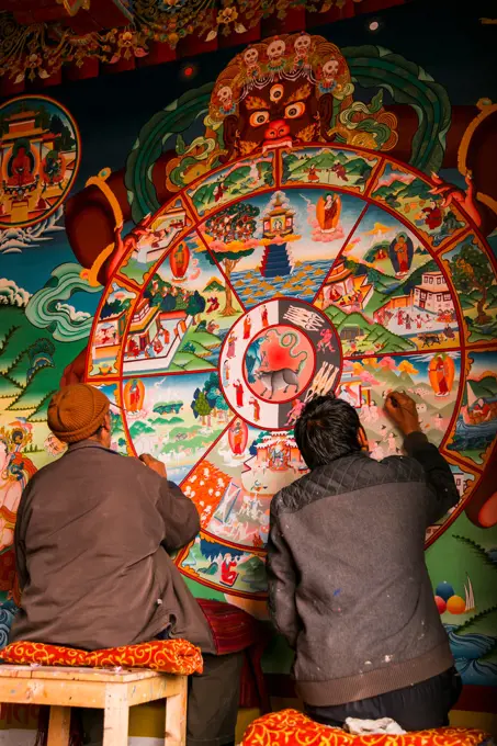 Men painting a mandala in Ladakh Northern India.