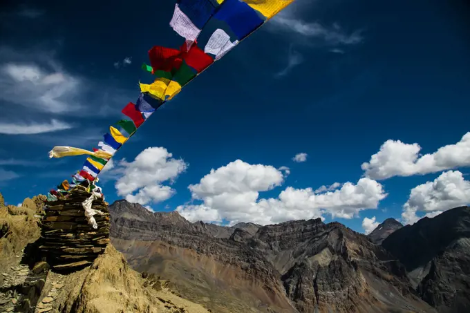 Mountain pass with prayer flags on a trekking in Zanskar valley.