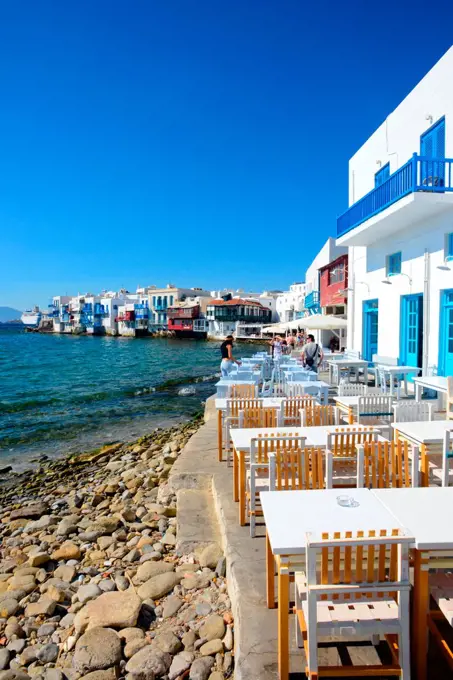 Cafe terrace with Little Venice in view, Mykonos, Greece