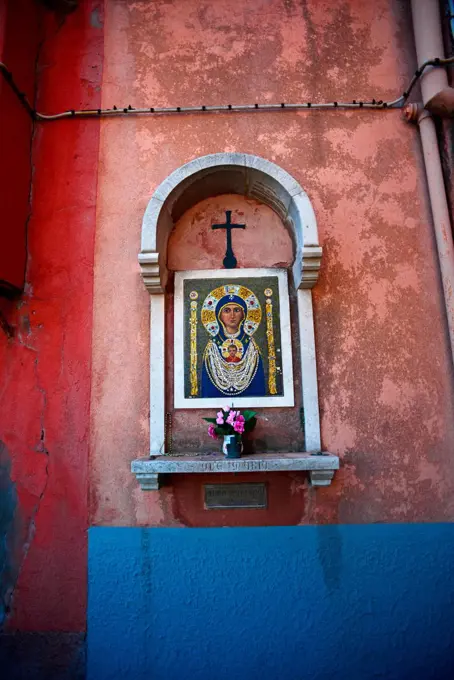 Catholic altar in the wall of a house at Murano, Venice, Italy