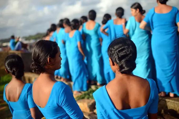 Numerous group of college students dressed in blue visit UNESCO World Heritage, Galle Fort, during Binara Full Moon Poya Day.