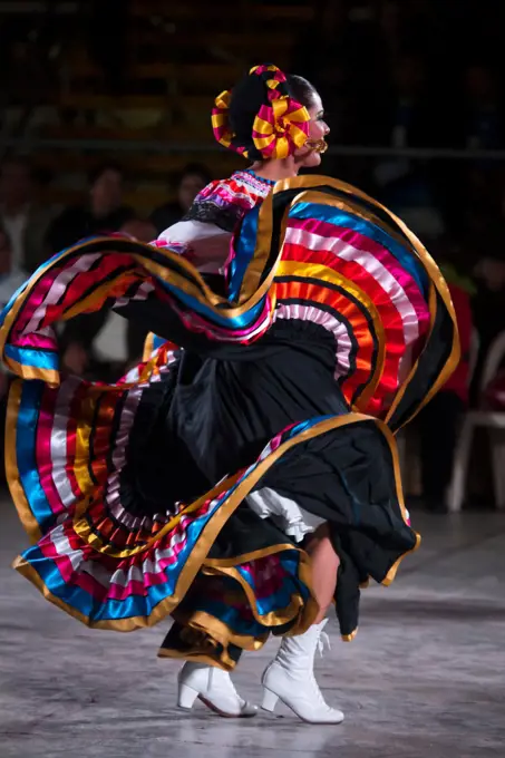 Woman dancing Son de la Negra. Mexican folk dance. International festival of folk dances El Buen Pastor School, municipality of Los Olivos, department of Lima, Colombia.