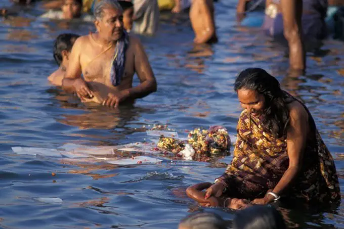 India, Varanasi, People bathing in river