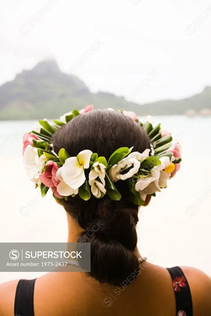 Tahiti, French Polynesia, Bora Bora, woman wearing headdress on beach