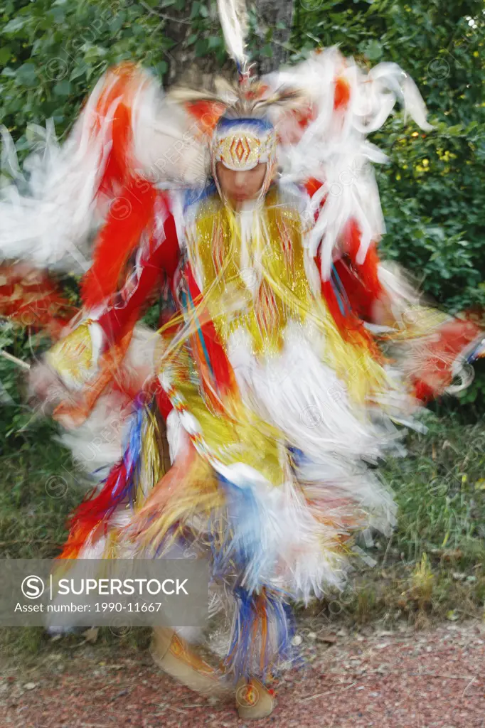 Blackfoot blood male dancer in traditional mens fancy dance outfit, Fort McLeod, Lethbridge, Alberta, Canada.