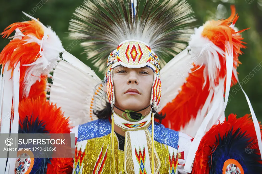 Blackfoot blood male dancer in traditional mens fancy dance outfit, Fort McLeod, Lethbridge, Alberta, Canada.