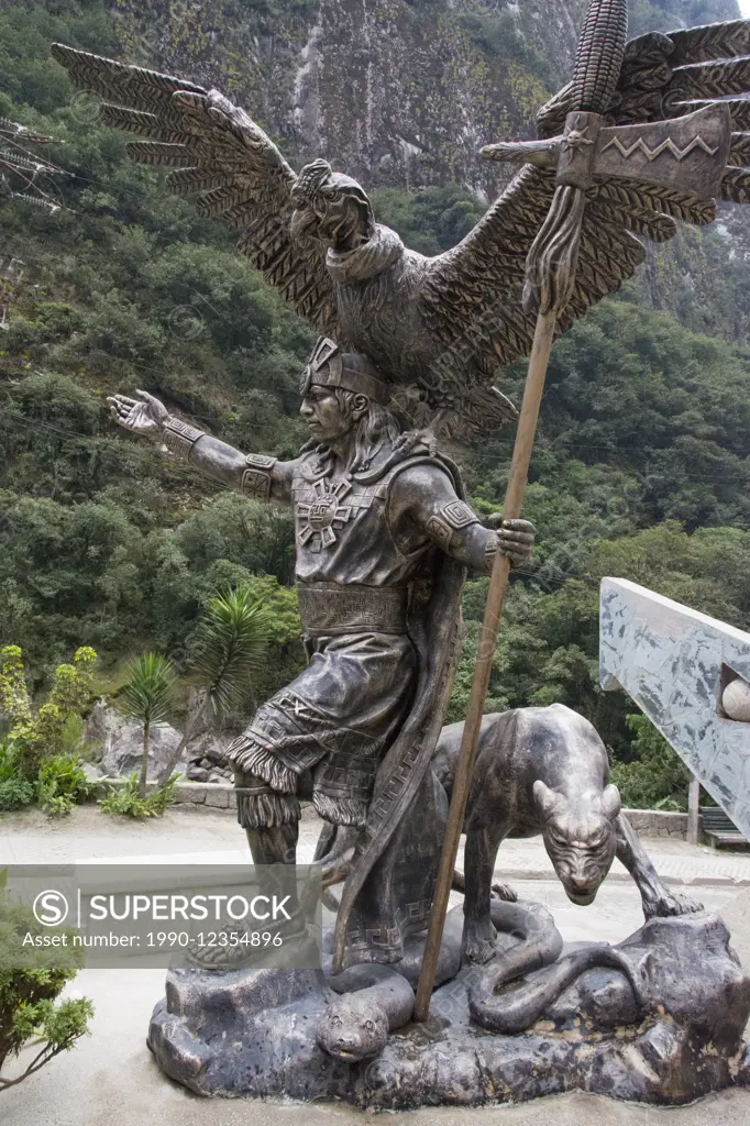 Inca cosmological trilogy statue, anaconda, Puma and condor, with Priest. Machu Picchu village, Peru