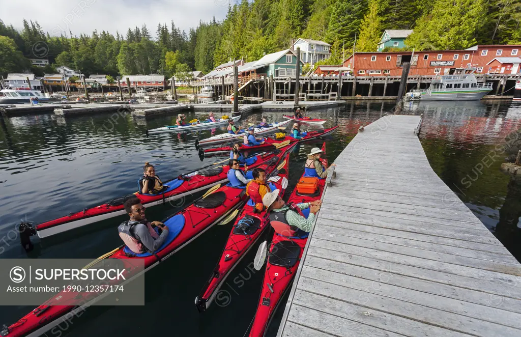 A group of kayakers prepares to paddle around the Johnstone Strait area, leaving from Telegraph Cove.