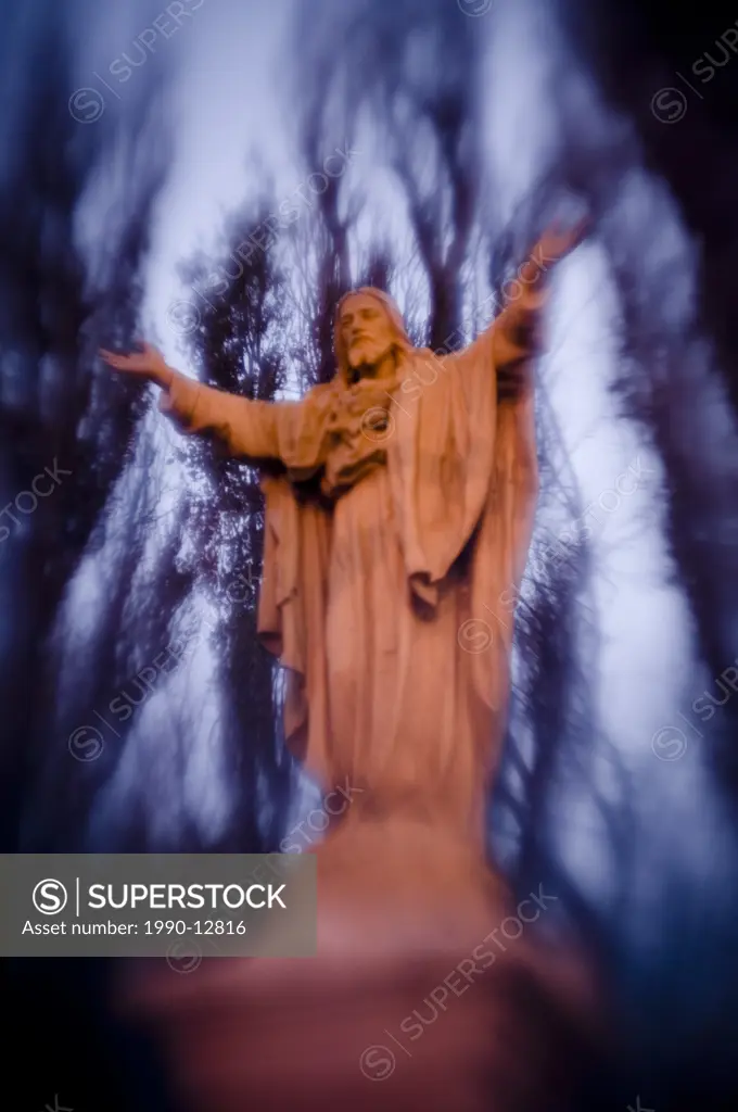 jesus statue with trees behind, Montreal, Quebec, Canada