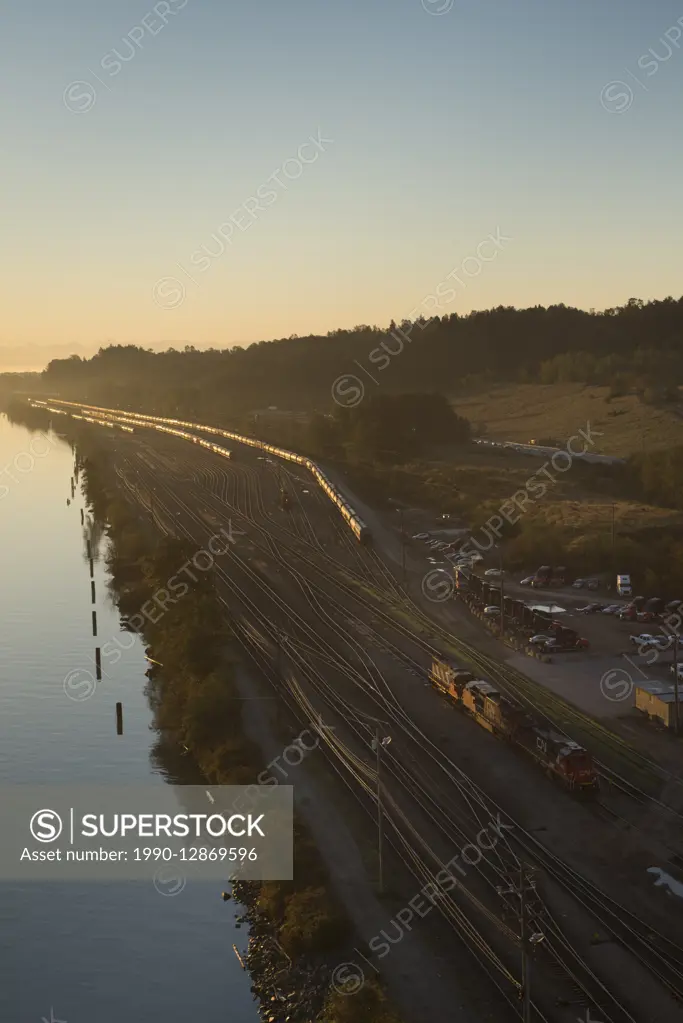 Overview of CN (Canadian National) rail yards and the Fraser River in Surrey, British Columbia, Canada