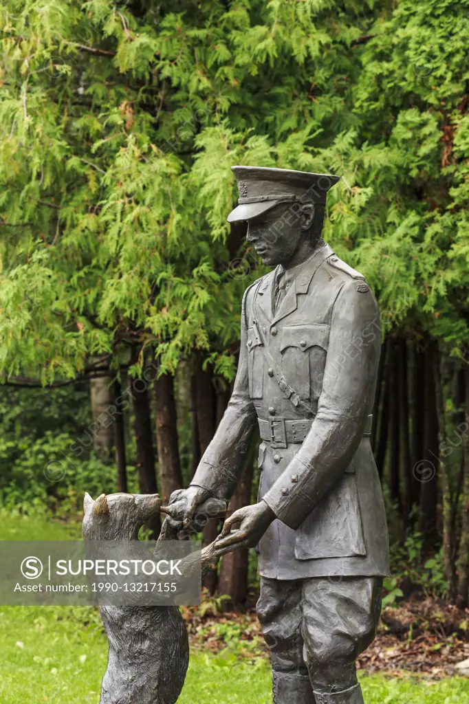 Bronze statue of Winnie the Pooh Bear with Lieutenant Harry Colebourn, Assiniboine Park, Winnipeg, Manitoba, Canada.