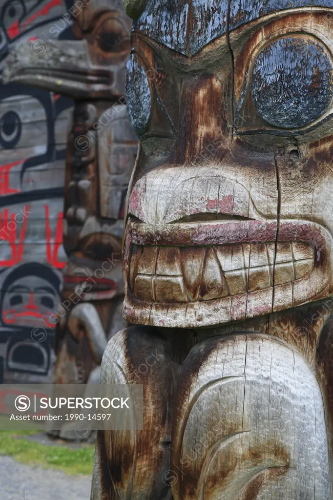 Detail of totem pole and longhouse, Ksan Historical Village and Museum, Hazelton, British Columbia, Canada