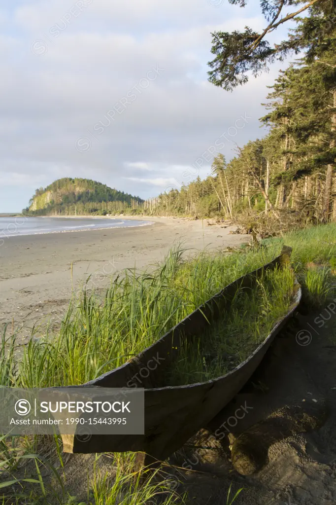 Haida dugout cedar canoe on Agate Beach, with Tow Hill shown, Haida Gwaii, formerly known as Queen Charlotte Islands, British Columbia, Canada