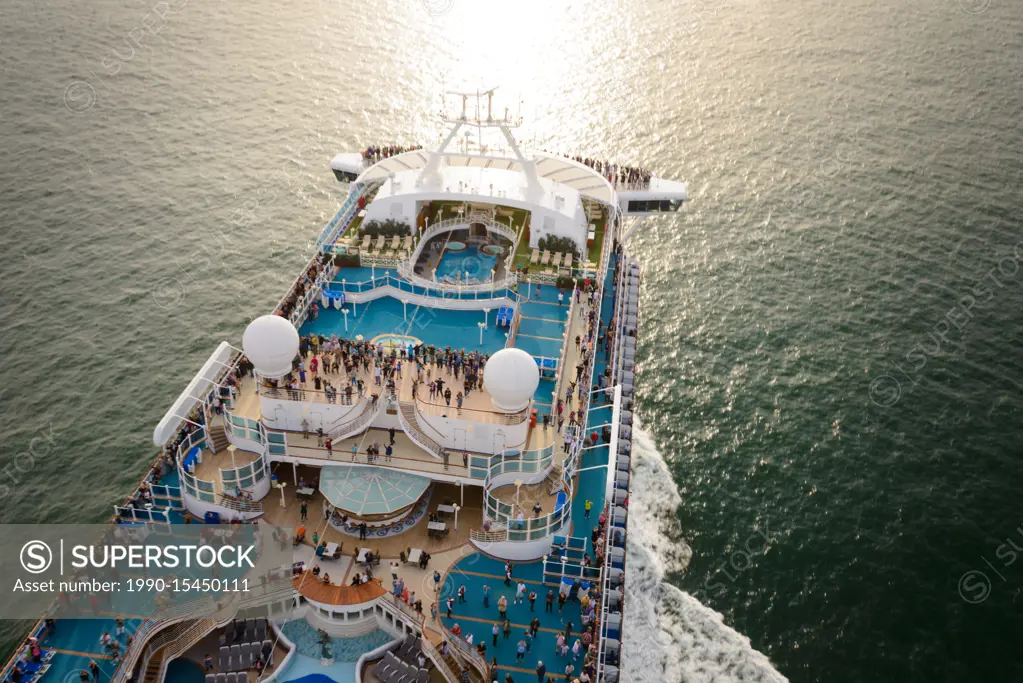 Overhead view of a cruise ship as it heads out to open water