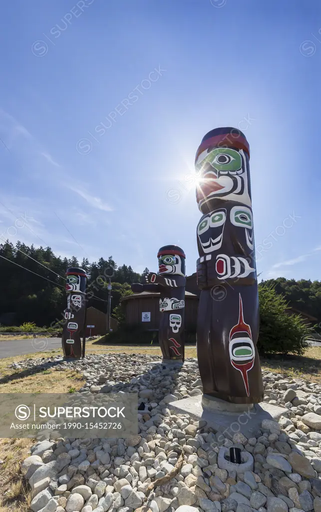 Totem Poles greet visitors to the first nations Nuyumbalees Cultural Centre on Quadra Island. British Columbia, Canada