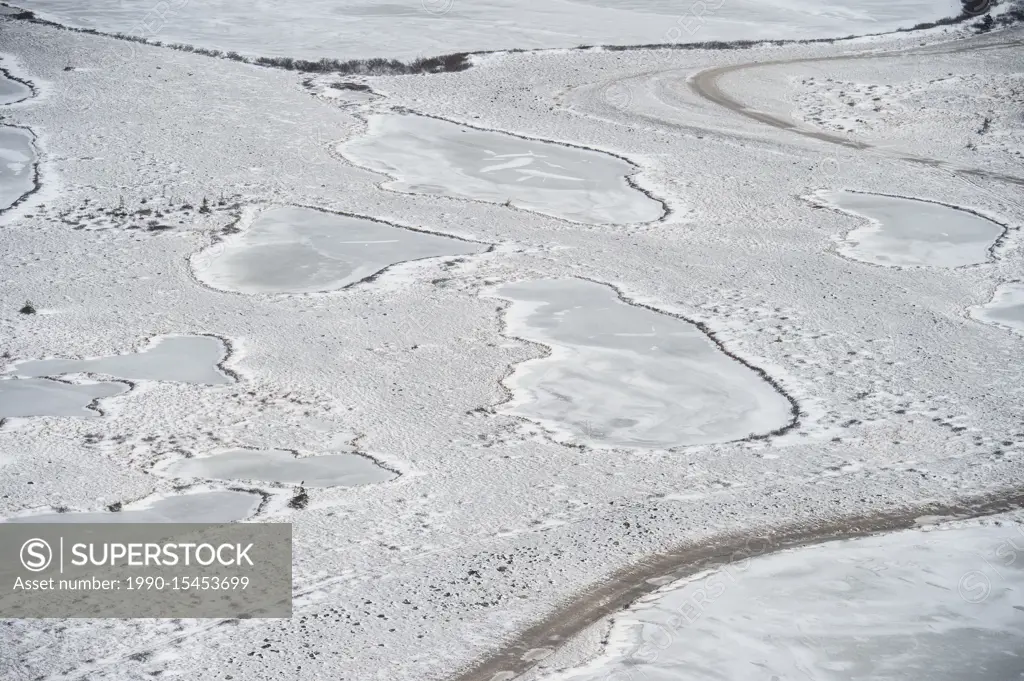 Hudson Bay coastline at freeze-up from the air- Frozen ponds with a light skiff of snow