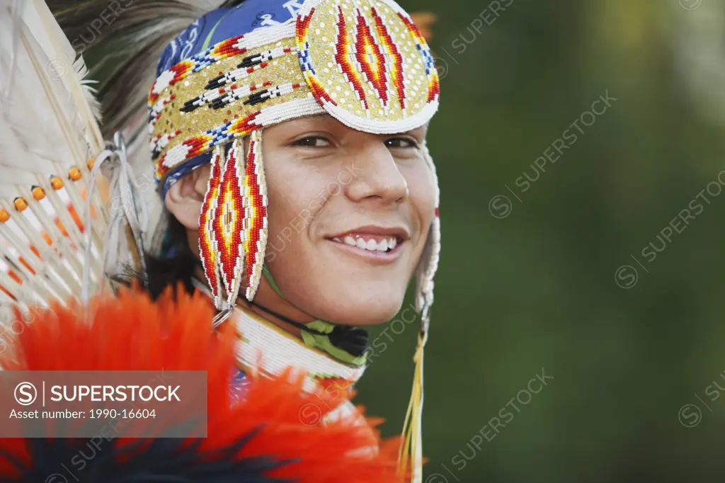 Young First Nations man from the Blackfoot Blood  in a Men´s Fancy Dance outfit, Canada