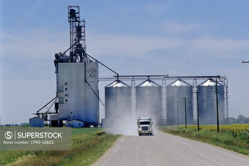 A grain truck leaves an inland grain terminal after delivering a load of grain near Winnipeg, Manitoba, Canada