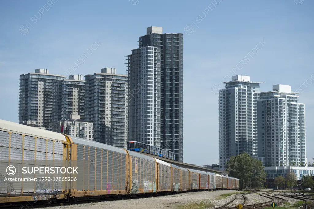 Rail yard, Skytrain and condominiums in New Westminster, British Columbia, Canada.