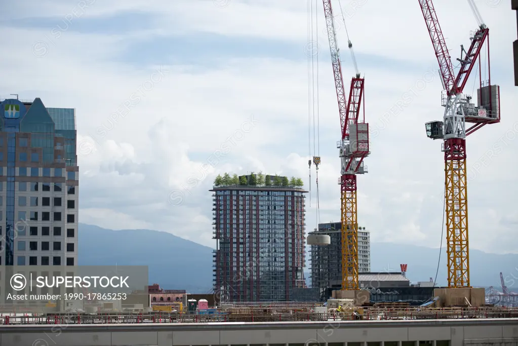 Construction cranes in downtown Vancouver, British Columbia, Canada