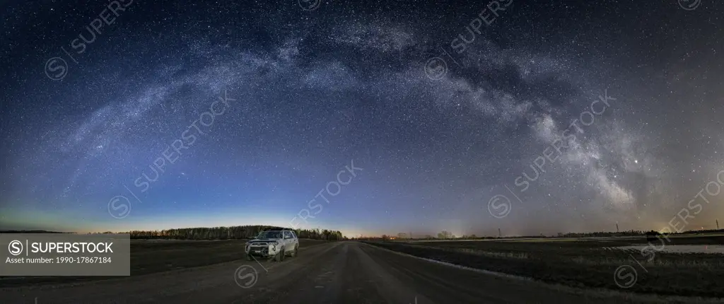 Full milkyway arc over rural road in Manitoba, Canada