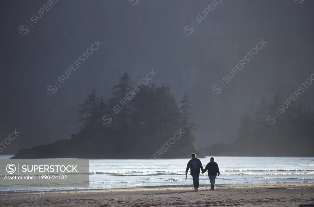 San Joseph Bay, Cape Scott Provincial Park - hiking couple on beach, Vancouver Island, British Columbia, Canada