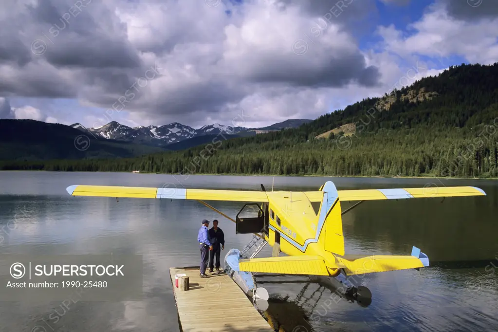 Fishing party arriving by float plane, Spruce Lake, South Chilcotin Range, British Columbia, Canada