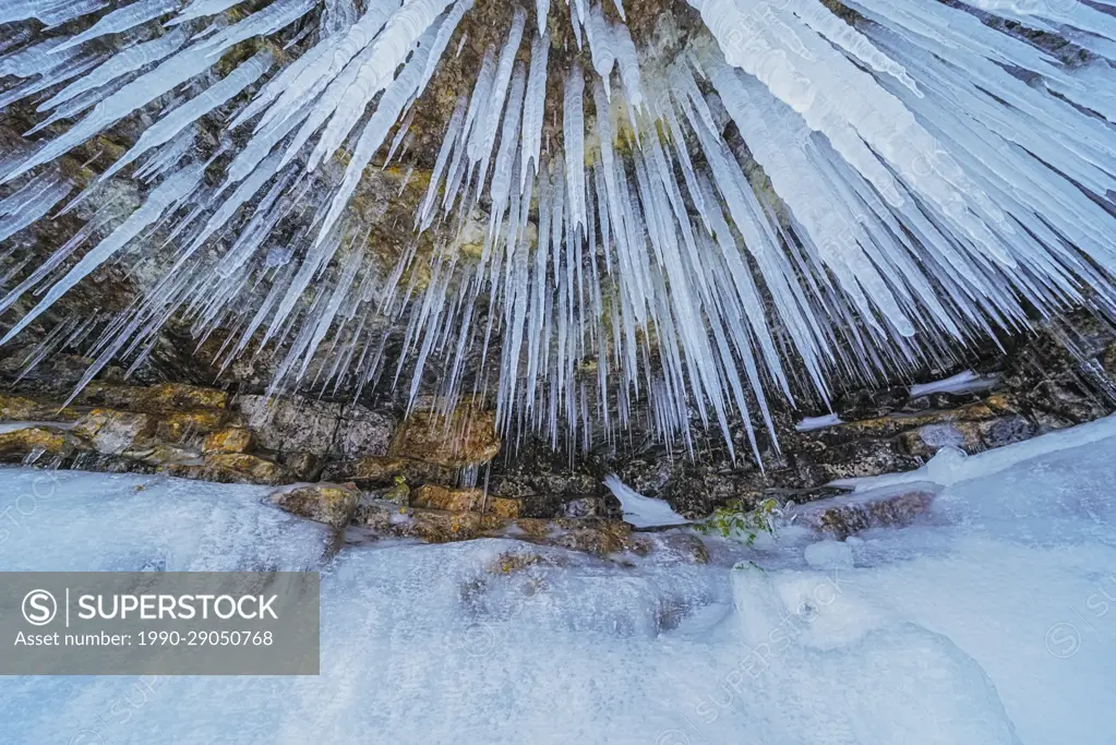 Icicles hanging down from limestone overhang, Tobermory, Ontario, Canada