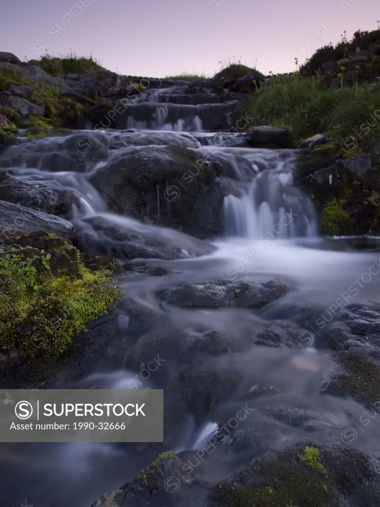 Purcell Creek flowing at dusk through the spectacular Selkirk and Purcell Mountain ranges near Golden, in the Kootenay/Columbia region of British Colu...