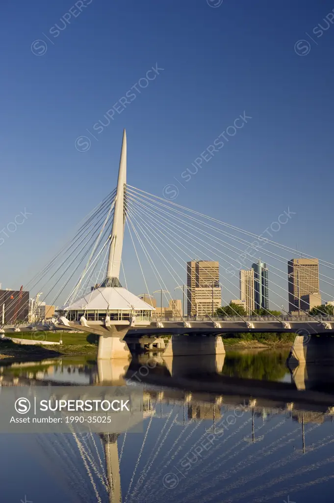 Winnipeg skyline showing close_up of the Esplanade Riel foot bridge over the Red River, from St. Boniface, Manitoba, Canada